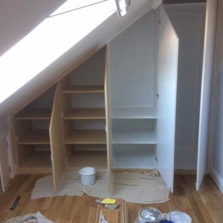 North London loft conversion including: plaster boarding, plastering, carpentry, painting & MDF inbuilt cupboards -